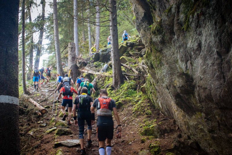 Climbing through a forest at Mont Blanc Marathon